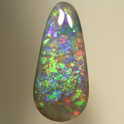 SOLID SEMI BLACK OPAL Pretty glittery show of greens and golds over blue and red. SEE VIDEO